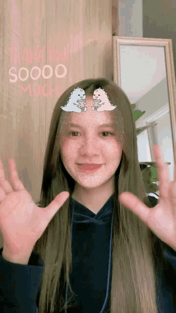 a girl with two dinosaurs on her face and the words thank you soooo much above her