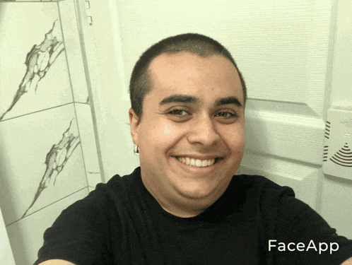 a man wearing a black shirt with faceapp written on the bottom
