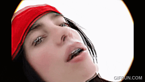 a close up of a woman 's face with the website gifrun.com visible in the corner