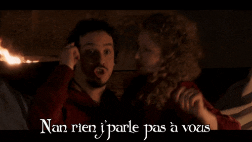 a man and a woman are sitting next to each other with the words nan rien j'parle pas a vous written below them