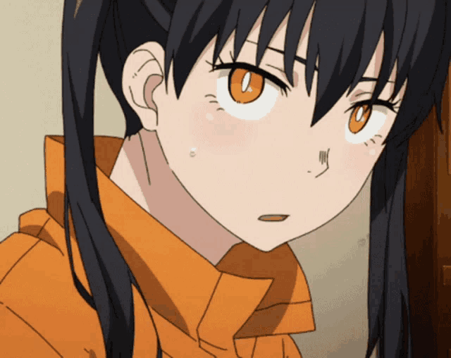 a close up of a girl 's face with orange eyes and black hair