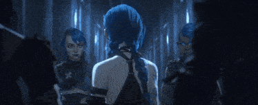 a woman with blue hair is standing in a dark room with other women .