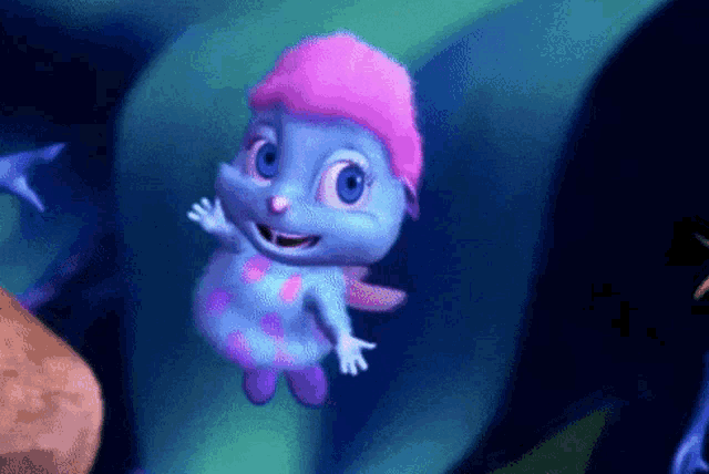 a blue cartoon character with a pink hat and wings is flying in the air .