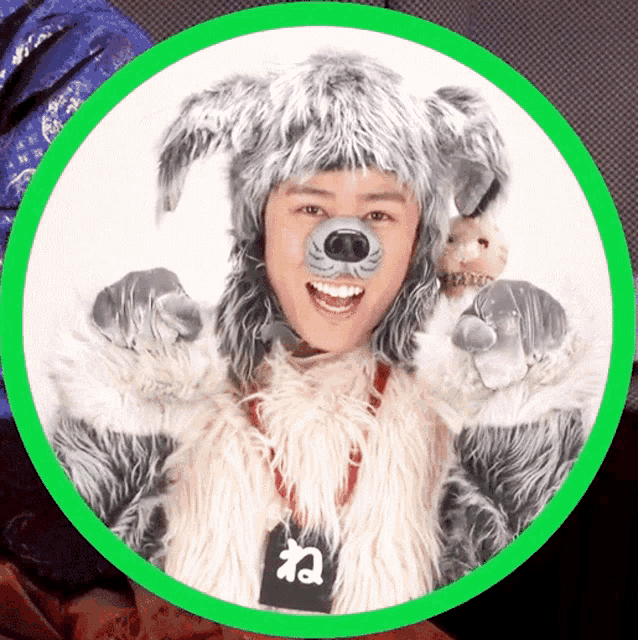 a person dressed in a wolf costume with a tag that says ' ね ' on it
