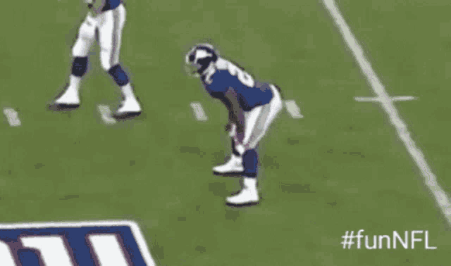 a football player in a blue jersey with the number 18 on it