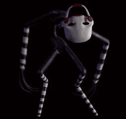 a black and white photo of a puppet with striped socks sitting in the dark .