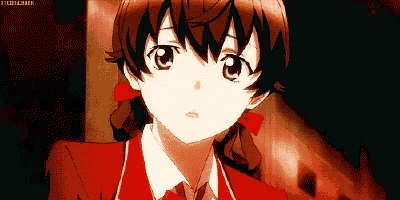 a girl in a red school uniform with a red bow in her hair is looking at the camera .