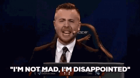 a man in a suit and tie says " i 'm not mad i 'm disappointed " in front of a laptop