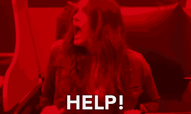 a woman is screaming in a red room and the word help is visible