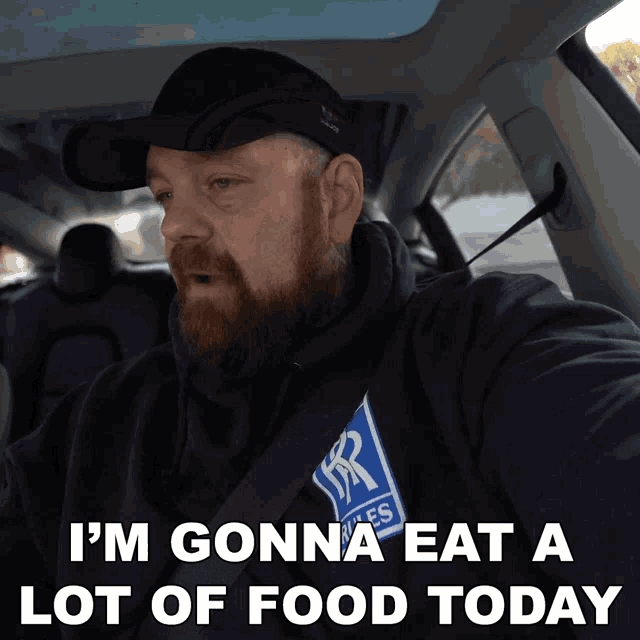 a man in a car with the words i 'm gonna eat a lot of food today below him