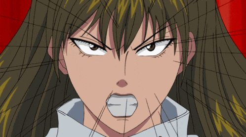a close up of a woman 's face with a white block in her mouth