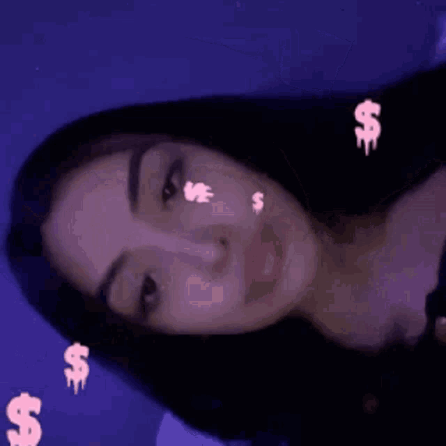 a close up of a woman 's face with a dollar sign on her face .