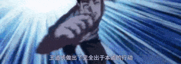 a man in a cape is pointing at something with chinese writing behind him .