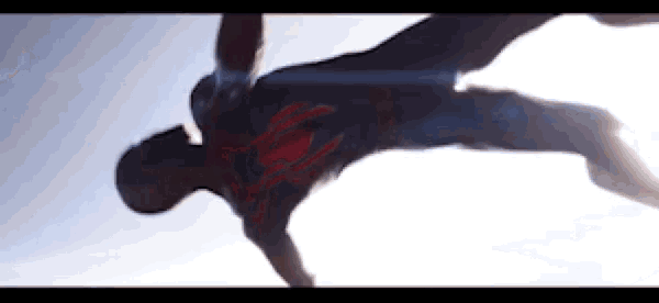 a man in a superhero costume is doing a trick in the air .