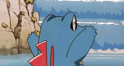 a blue and red cartoon character is standing in the water near a rocky cliff .