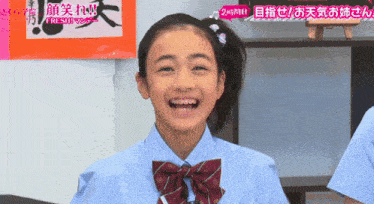 a girl with braces on her teeth is smiling in front of an orange sign that says fresh