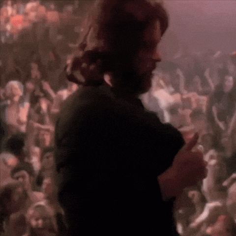 a blurry picture of a man in a crowd of people