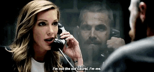 a woman is talking on a cell phone to a man .