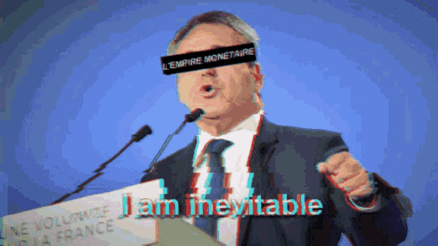 a man speaking into a microphone with a band around his eyes that says " l' empire monetaire " on it