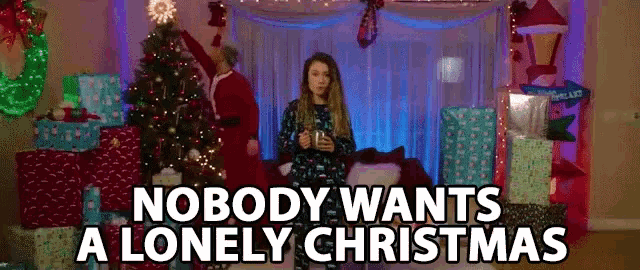 a woman is standing in front of a christmas tree with the words nobody wants a lonely christmas below her .