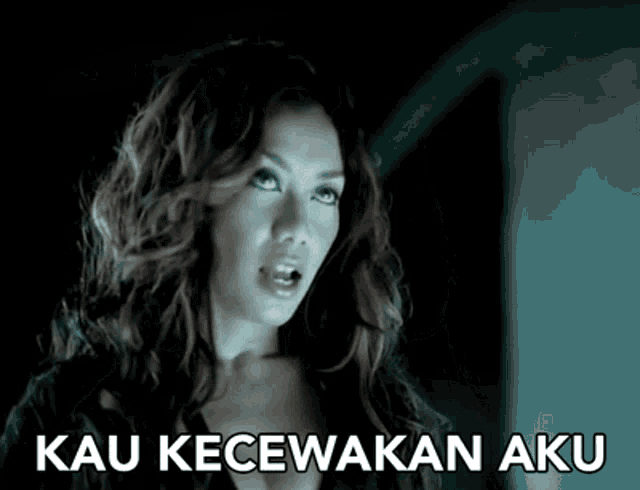 a woman with red hair is making a funny face with the words kau kecewakan aku below her