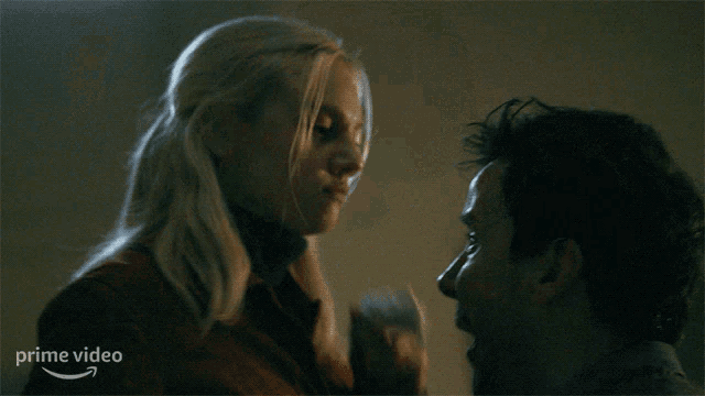 a woman kissing a man with the words " don 't say a fucking word "