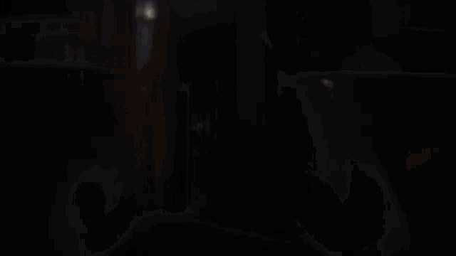 a light is shining through a hole in the dark
