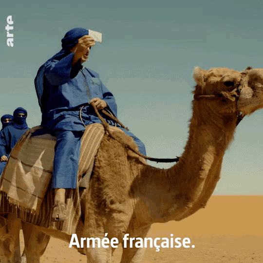 a man riding on the back of a camel with the words armee francaise on the bottom