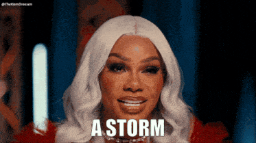 a woman with white hair says a storm in front of her