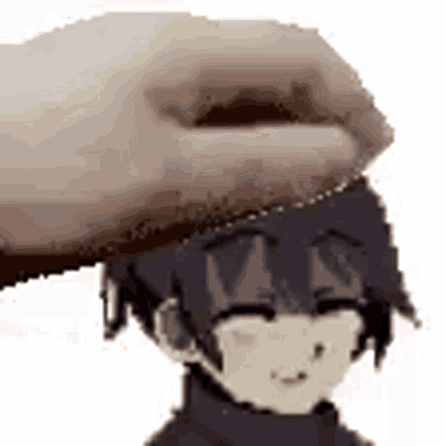 a hand is putting something on the head of a anime character .