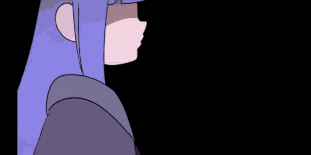 a close up of a person 's face with a purple sweater on .
