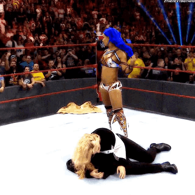 a woman in a wrestling ring with the hashtag #thenextbigthing on the bottom