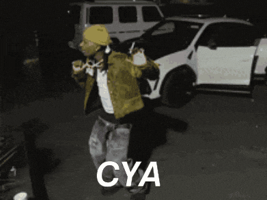 a man in a yellow jacket is dancing in front of a white car that says cya on the bottom
