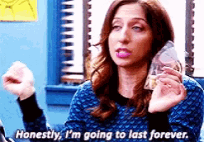 a woman is holding a glass and saying `` honestly , i 'm going to last forever ''