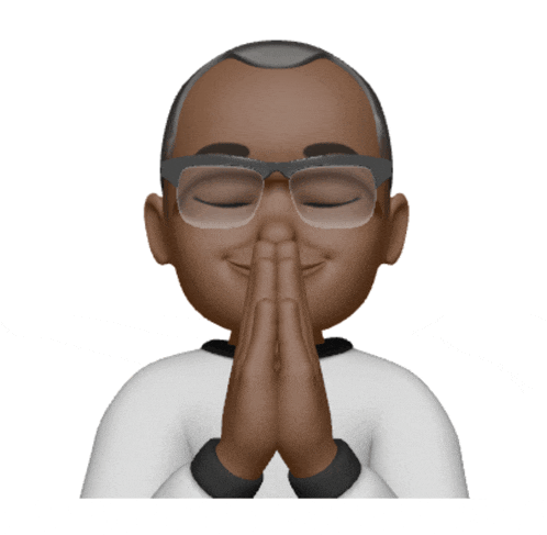 a man wearing glasses is praying with his hands together