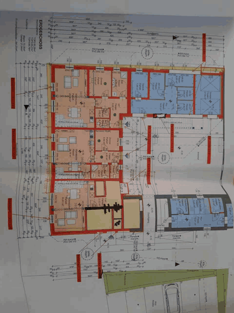 a floor plan of a house with a car parked in the driveway