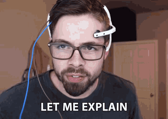 a man wearing glasses and a headset says " let me explain "