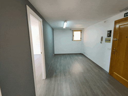 a hallway with a wooden door and a window