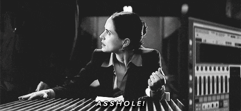 a black and white photo of a woman with the words asshole on the bottom