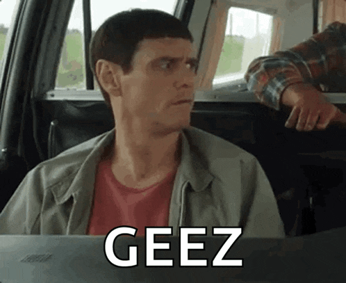 a man is sitting in the back seat of a car with the word geez written on the screen .