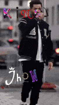 a man wearing a jacket that says football is smoking a cigarette