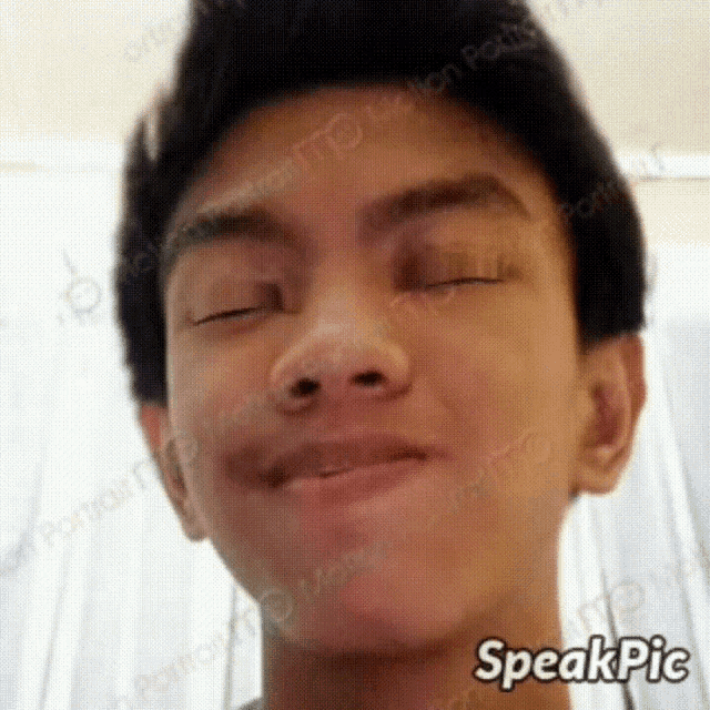 a young man making a funny face with his eyes closed and the words speakpic on the bottom
