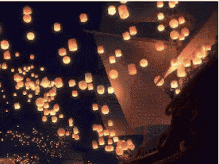 many lanterns are flying in the night sky
