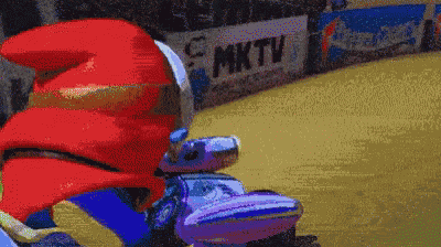 a sign that says mktv is in the background of a cartoon