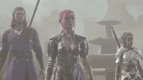 a man and two women are standing next to each other holding swords