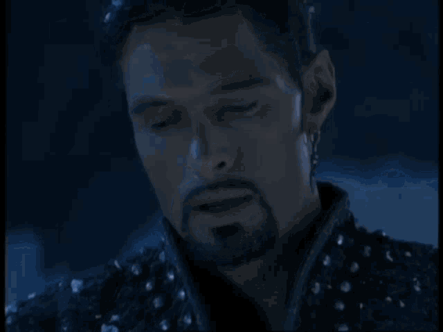 a man with a beard says i love you xena in yellow letters