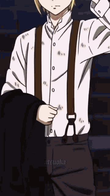 a man is wearing suspenders and a white shirt .