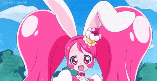 a girl with pink hair and bunny ears is standing in front of a blue sky with a flower in her hair .