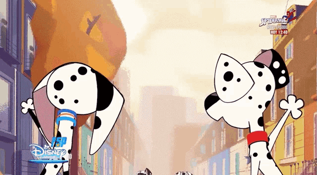 two dalmatian dogs standing on a city street with a disney logo on the bottom