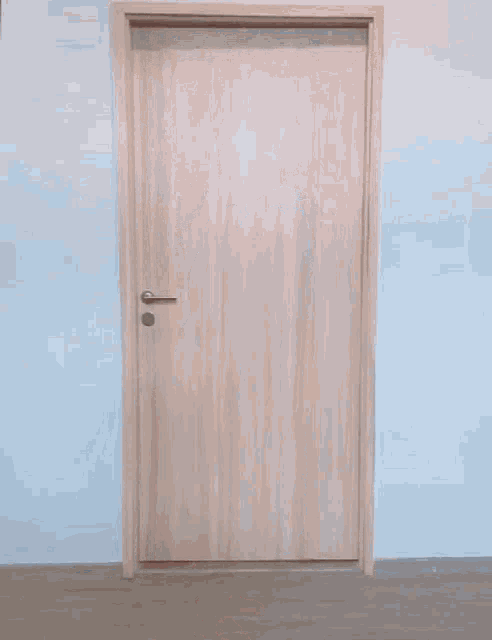 a person standing in a doorway with a pillow wrapped around their head